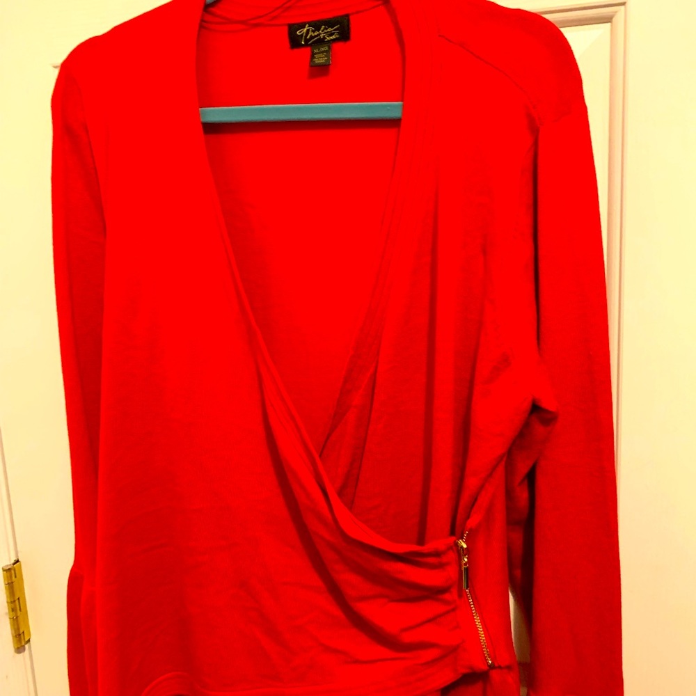 A lovely red faux wrap sweater. Deep v neck.